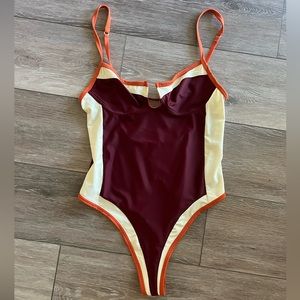 Out from under body suit